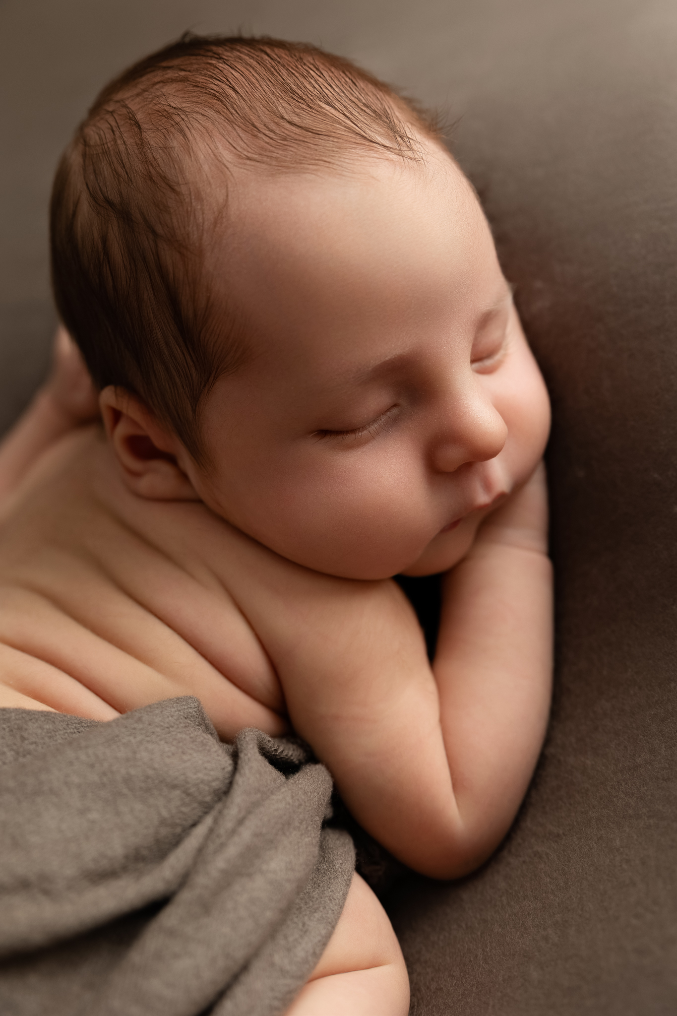 Sleeping newborn baby posed on soft blanket photographed by Fresno California newborn photographer Stephanie Leal