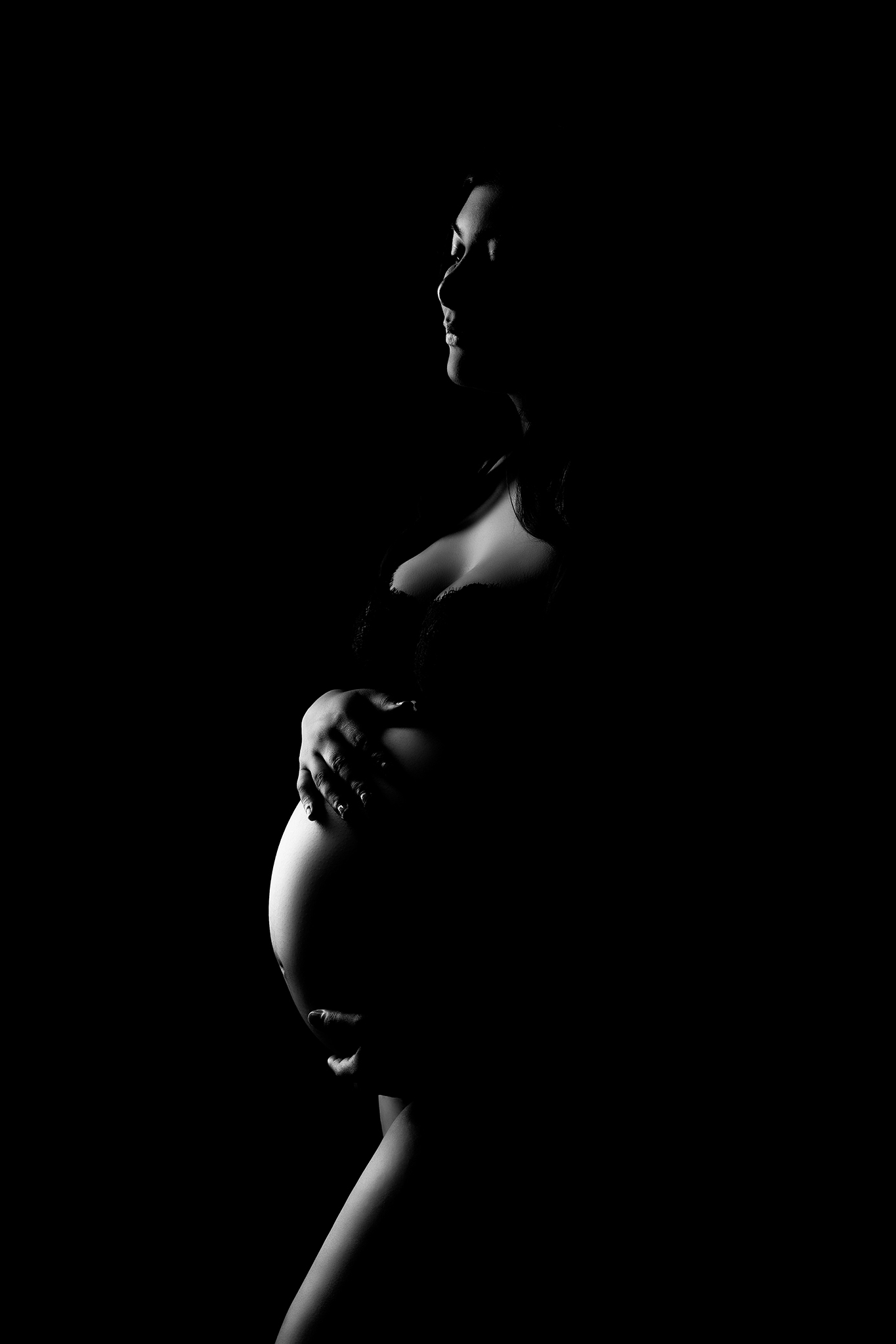 Silhouette maternity portrait of expectant mother photographed by Fresno maternity photographer