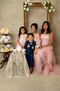 Mother and children during a Bridgerton-inspired Mother's Day tea time portrait session in Fresno, California